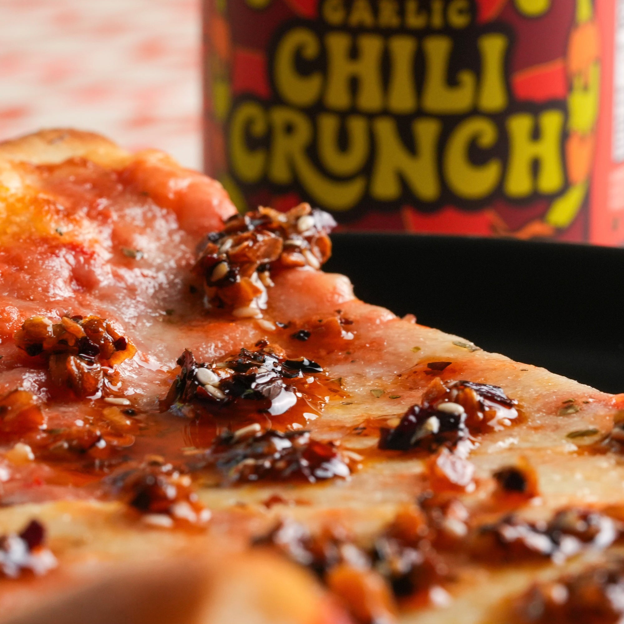 jar of SIJANG chili crunch + close up of chili crunch on pizza